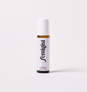 10ml roller bottle of Hairy Godmother facial hair reducing oil by Femigist, with a purple and white label