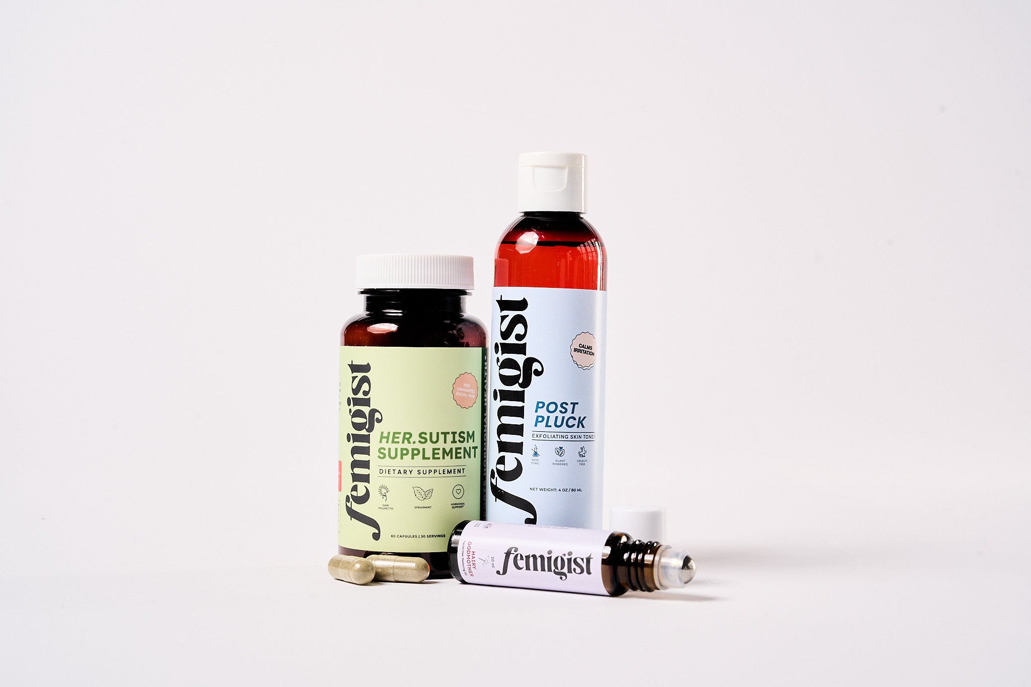 Femigist Chin Kit - HER.sutism Supplement, Post Pluck Exfoliating Toner, and Skin Roller. A complete solution for chin hair, ingrown hairs, and dark marks.